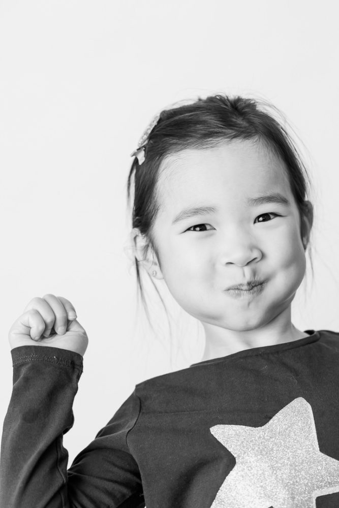 Classic black & white kids portrait photography - little girl pulling a silly face by Paper Bunny Studios Edmonton 