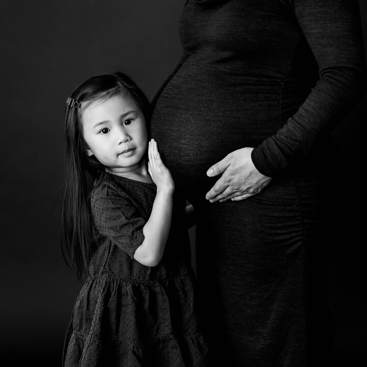 Black and white maternity portrait of soon to be big sister and bump by Edmonton Portrait Photographer Paper Bunny Studios