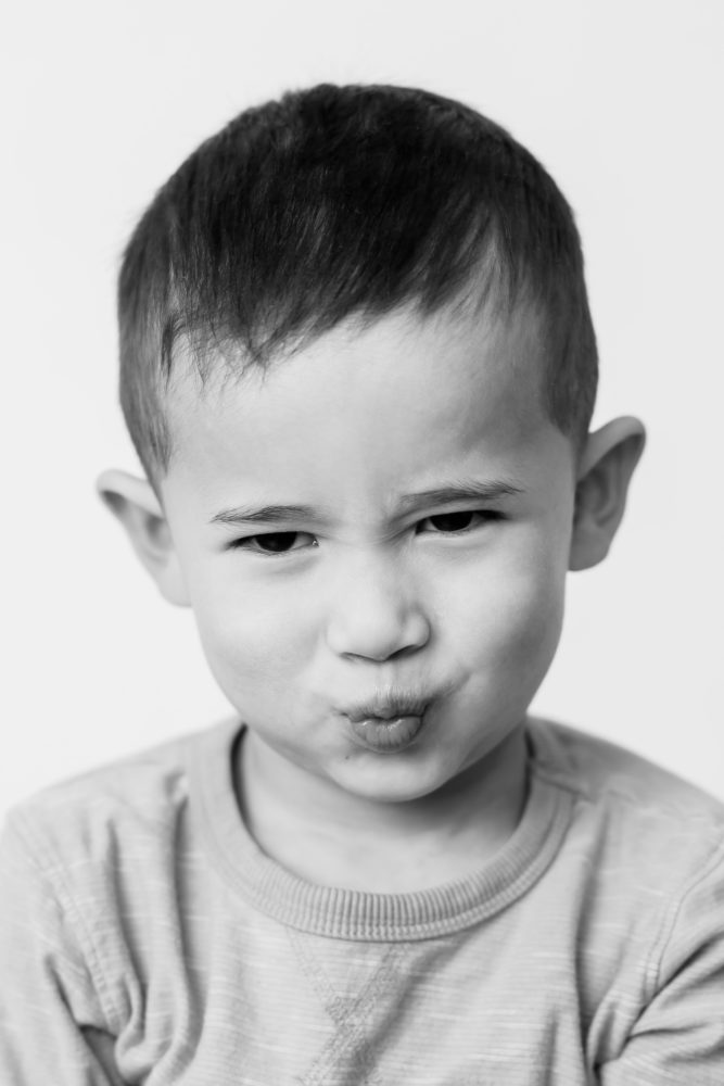 Classic black & white kids portrait photography - little boy making a silly face by Paper Bunny Studios Edmonton 