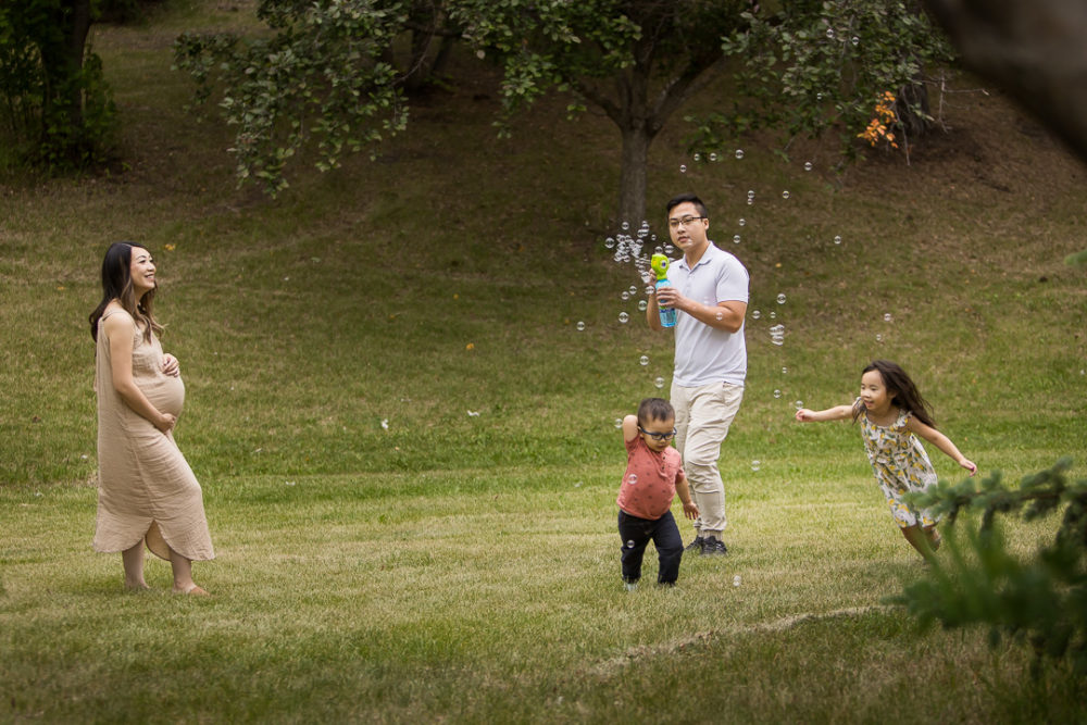 Outdoor family photos with bubbles by Paper Bunny Studios Edmonton