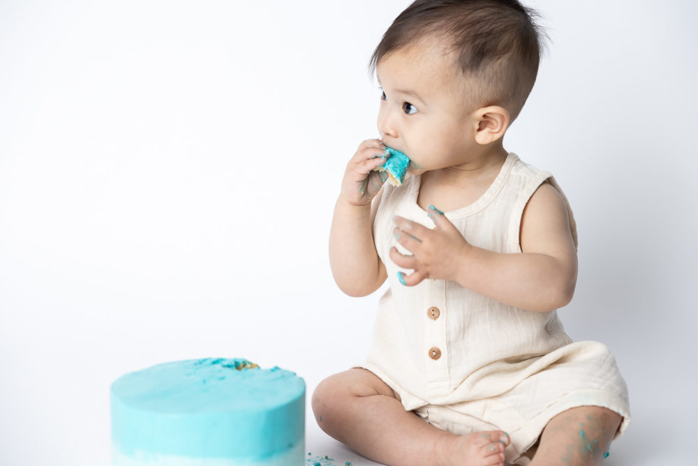 First Birthday Cake Smash photography - baby eating cakeby Paper Bunny Studios Edmonton