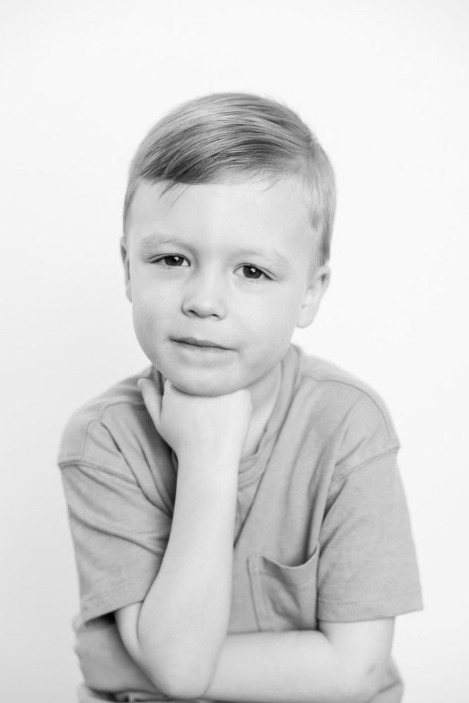 Classic black & white kids portrait photography - little boy in thinker pose by Paper Bunny Studios Edmonton 