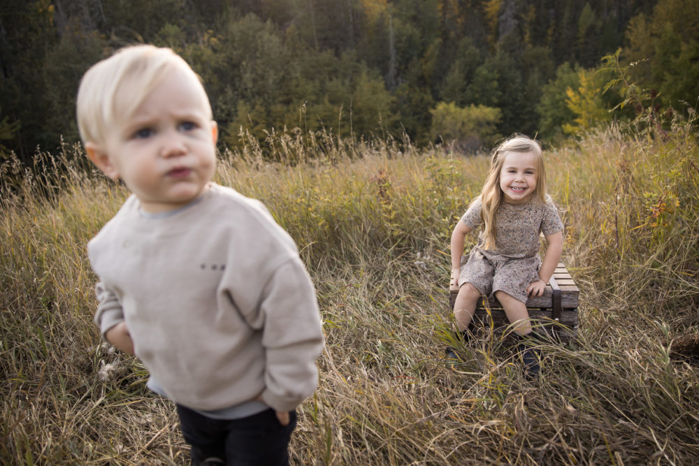 Edmonton outdoor family photos - candid sibling photo by Paper Bunny Studios