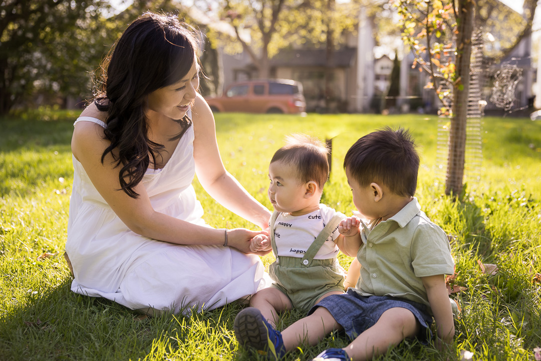 Mom & kids sat together for outdoor family photo by Paper Bunny Studios Edmonton