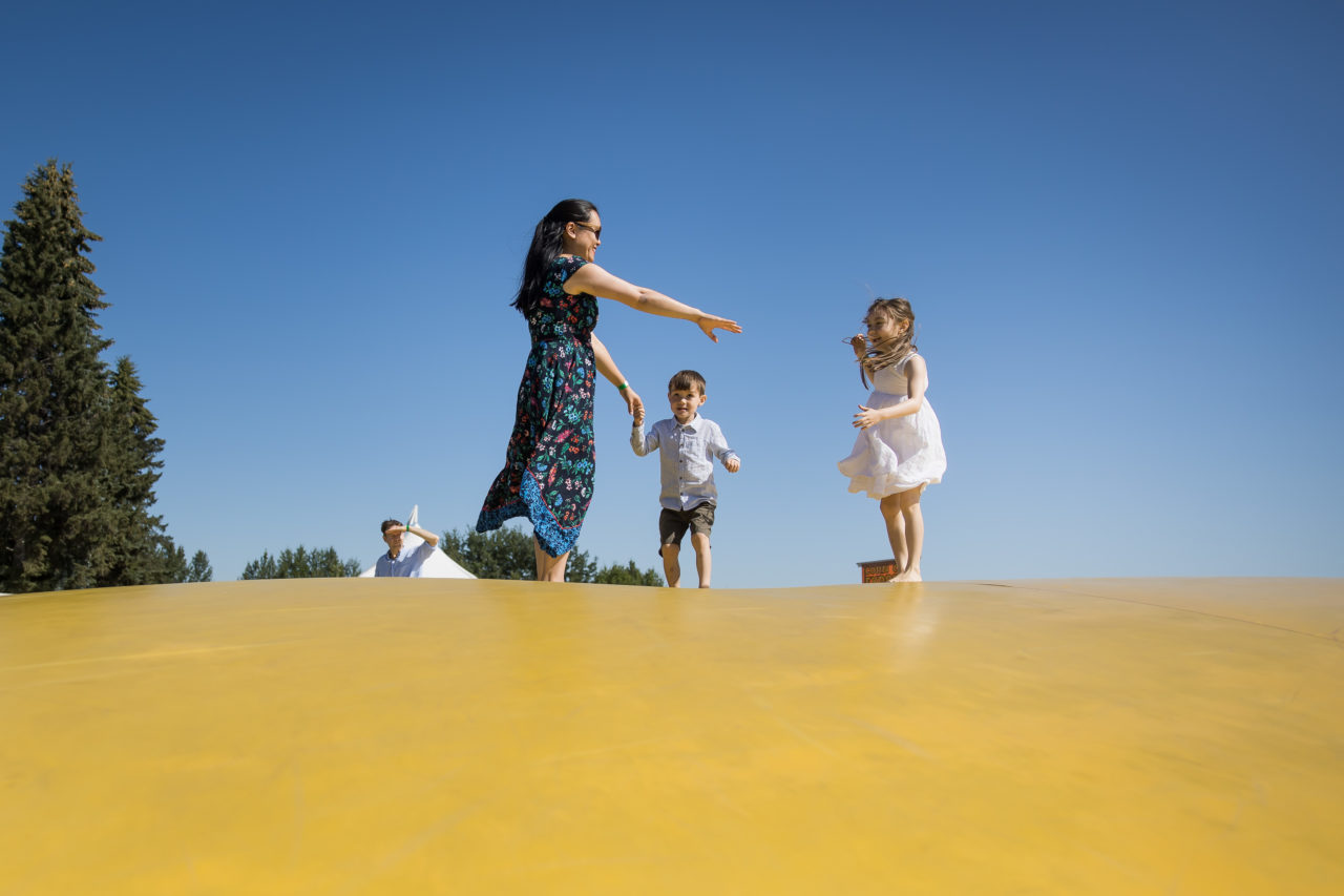 Edmonton corn maze family photography by Paper Bunny Studios - family on the bouncy trampoline