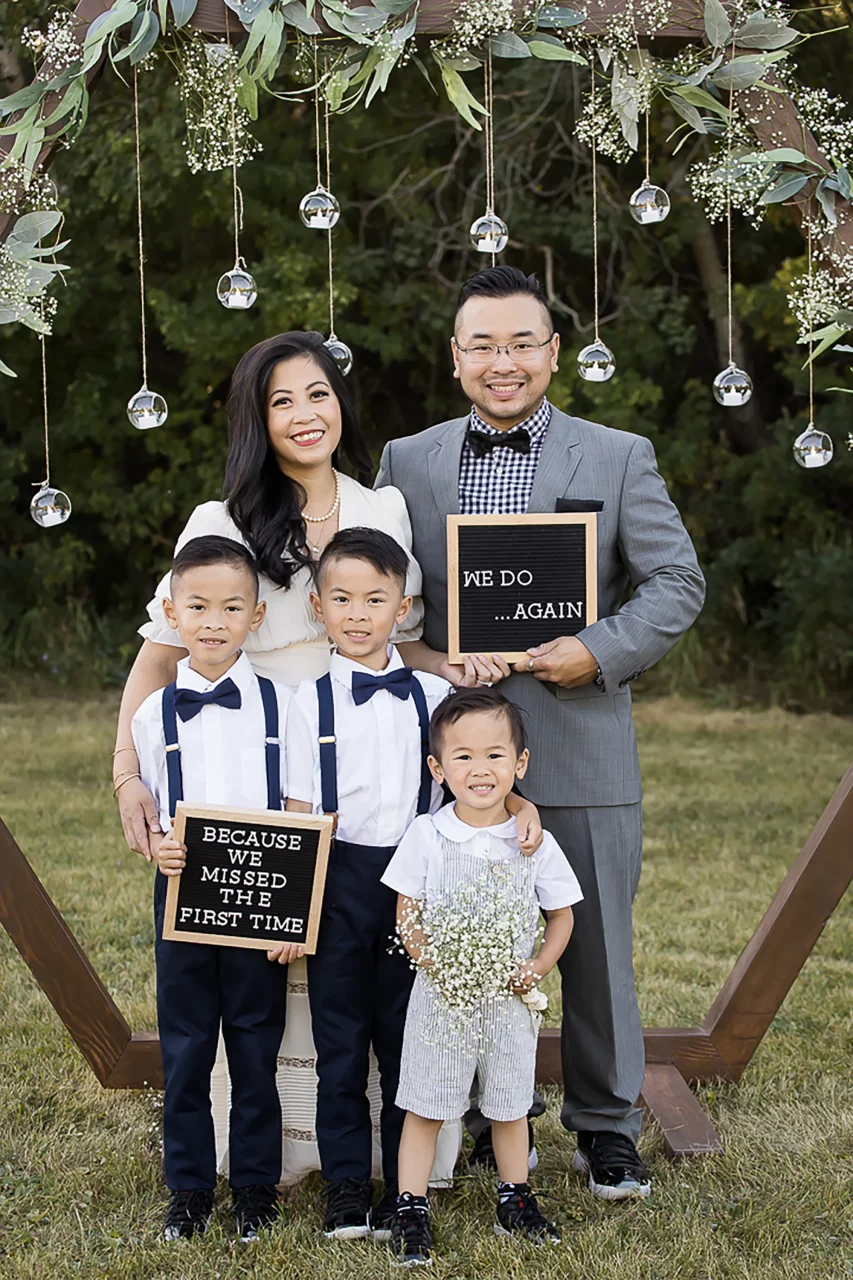 Documentary family photography - vow renewal chalkboard signs & family in front of altar by paper bunny studios Edmonton