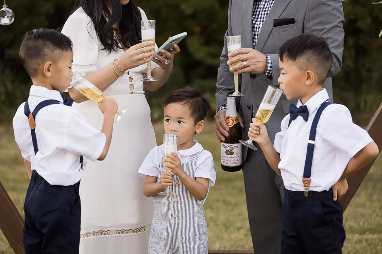 Documentary family photography - celebratory drinks after vow renewal by paper bunny studios Edmonton
