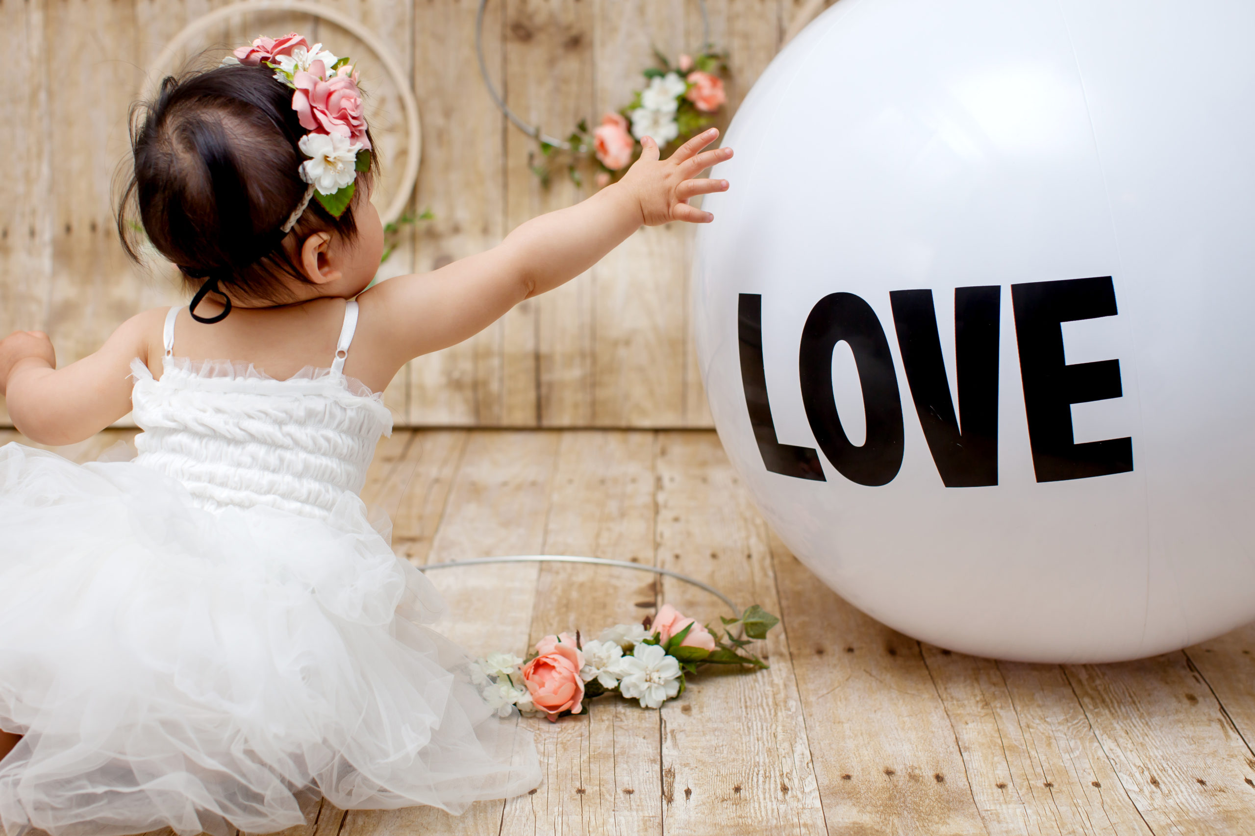 Studio family portrait photography with Love balloon prop